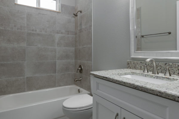 Guest Bathroom Vanity | Grey Countertops | White Cabinets